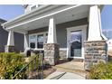 Inviting front porch with stone pillar bases and comfortable seating area at 514 Nixon Rd, Belmont, NC 28012