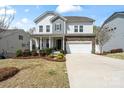 Charming two-story home with a manicured front yard, stone accents, and a welcoming front porch at 7200 Irongate Dr, Indian Land, SC 29707