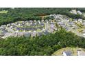 An elevated shot highlights the home's position in a well-maintained neighborhood with lush greenery at 7200 Irongate Dr, Lancaster, SC 29720