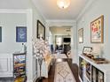 Elegant foyer featuring hardwood floors, decorative rugs, and views into the adjacent living spaces at 7200 Irongate Dr, Lancaster, SC 29720