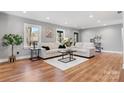 Bright living room featuring hardwood floors, neutral walls, and stylish furniture arrangement at 1206 9Th Nw St, Hickory, NC 28601