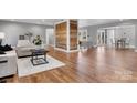 Spacious living room with hardwood floors, wood accent wall, open layout and plenty of natural light at 1206 9Th Nw St, Hickory, NC 28601