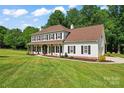 Inviting two-story home with a spacious front yard and attractive landscaping at 1226 Flint Ct, Matthews, NC 28104