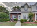 Charming two-story home with brick and siding exterior, complemented by lush landscaping and a welcoming entrance at 12928 Sickles Dr, Charlotte, NC 28273