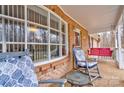 Cozy front porch with rocking chairs and a porch swing, perfect for enjoying the outdoors at 1925 S Lafayette St, Shelby, NC 28152