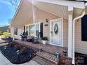 Inviting front porch with brick steps and cozy rocking chairs at 1937 Hickory Dr, Lancaster, SC 29720