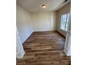 Inviting bedroom with natural light, showcasing luxury vinyl flooring and neutral color palette at 1941 Olsen Ln, Charlotte, NC 28213