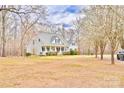 Beautiful home surrounded by mature trees, offering a serene and private setting at 2025 Sojourn Rd, Marshville, NC 28103