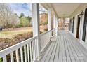 Inviting covered porch with white columns, providing a perfect spot for relaxation at 2025 Sojourn Rd, Marshville, NC 28103