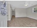 Spacious living room featuring wood-look floors and plenty of natural light at 2211 Waverly St, Albemarle, NC 28001