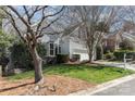 Inviting home with a lush lawn, mature trees, and manicured shrubs enhance curb appeal at 2320 Christensens Ct, Charlotte, NC 28270