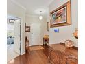 Traditional foyer with hardwood floors, elegant console table and a decorative painting at 2437 Grinstead Ct, Clover, SC 29710