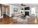 Staged living room featuring a fireplace, hardwood floors and ample space at 2919 Park Rd, Charlotte, NC 28209