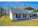 Rear view of single story house with a fence and landscaping at 3345 Hunting Wood Ct, Gastonia, NC 28052