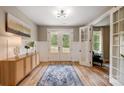 Stylish entryway with natural light, wood floors, and an adjacent office space at 388 Speedway Nw Pl # 1, Concord, NC 28027