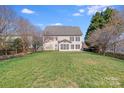 Expansive backyard features lush lawn and mature trees offering privacy at 485 Sutro Forest Nw Dr, Concord, NC 28027