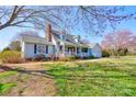 Charming home featuring a welcoming front porch, beautiful landscaping, and a classic design at 723 W Zion Church Rd, Shelby, NC 28150