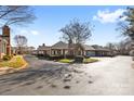 Beautiful brick homes surrounded by mature trees in a well-maintained neighborhood at 8328 Highland Glen Dr, Charlotte, NC 28269