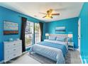 Bright bedroom with calming turquoise walls, white trim, and a large window at 12727 Bullock Greenway Blvd, Charlotte, NC 28277