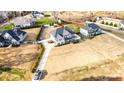 Spacious home with a long driveway and fenced backyard in a quiet neighborhood, seen from an aerial perspective at 2605 Lakefront Dr, Belmont, NC 28012