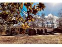 Beautiful brick home featuring mature trees and a well-kept lawn, creating a warm and inviting curb appeal at 3580 5Th Ne St, Hickory, NC 28601