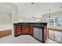 Well-appointed kitchen featuring granite countertops, stainless steel appliances, and tile flooring at 41062 Calla Lily St, Fort Mill, SC 29707