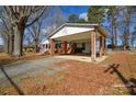 Carport area with brick pillars attached to house at 571 Amity Se Ave, Concord, NC 28025