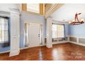 Bright entryway with hardwood floors, elegant chandelier, and staircase creating a welcoming atmosphere at 631 Winding Branch Rd, Rock Hill, SC 29732