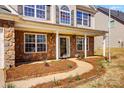 Inviting front porch with stone accents and walkway, leading to a charming home exterior and well maintained garden at 631 Winding Branch Rd, Rock Hill, SC 29732