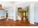 Spacious living area with hardwood floors, elegant staircase, and natural light creating a warm ambiance at 631 Winding Branch Rd, Rock Hill, SC 29732