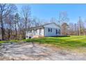 Charming single-story home featuring a brick facade, well-maintained lawn and new landscaping at 108 Spiral Ln, Shelby, NC 28152