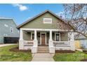 Charming two-story home with a well-manicured lawn and inviting front porch at 1418 Seigle Ave, Charlotte, NC 28205