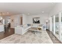 Bright living room with a large sectional sofa, area rug, and sliding doors to the outdoor space at 208 Wesser St # 8, Davidson, NC 28036