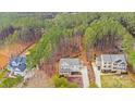 An aerial view of a home showcasing its location amidst a lush, wooded neighborhood at 220 Kenway Loop # 41, Mooresville, NC 28117