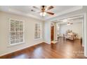 Bright room with hardwood floors, a tray ceiling, and lots of natural light from two windows at 220 Kenway Loop # 41, Mooresville, NC 28117