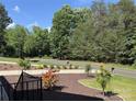 View from the porch showing landscaping and the street in front of the property at 220 Kenway Loop, Mooresville, NC 28117