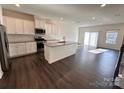 Modern kitchen featuring stainless steel appliances and a spacious island at 2623 Aubrey St, Monroe, NC 28110