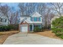 Charming two-story home featuring a brick accent garage and beautiful blue shutters at 3554 Laurenhurst Ln, Charlotte, NC 28270