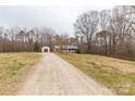 Wide shot of a home with a long driveway on a big lot at 4187 Bessie Hudson Rd, Lancaster, SC 29720