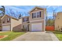 Attractive home boasting neutral siding, black shutters, complemented by a concrete driveway and well-maintained lawn at 5830 Kelden Walker Ln, Charlotte, NC 28269