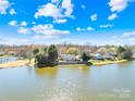 Scenic aerial view showcasing the home's lakeside location with serene water views and lush surrounding landscape at 6325 Martin Lake Rd, Charlotte, NC 28227