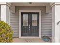 Close-up of elegant double front doors with decorative glass inserts and house number 944 at 944 Treasure Ct, Fort Mill, SC 29708