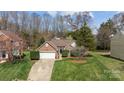 Beautiful brick home with a well-manicured lawn and two-car garage, nestled in a quiet neighborhood at 11542 Laurel View Dr, Charlotte, NC 28273