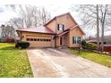 Lovely home featuring an attached two-car garage and well-maintained front yard at 1228 Hidden Creek Cir, Hickory, NC 28602