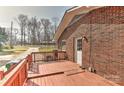 Cozy wooden deck offering a serene outdoor space adjacent to the brick home at 1235 Robinhood Cir, Charlotte, NC 28227
