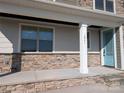 A welcoming covered porch with stone accents, a bright blue front door, and the house number clearly displayed at 1921 Hendricks St, Rock Hill, SC 29732