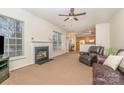 Cozy living room featuring a fireplace, and leather furniture at 3612 Brookstone Trl, Indian Trail, NC 28079