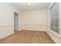 Neutral room with crown molding, chair rail and a large window at 3612 Brookstone Trl, Indian Trail, NC 28079