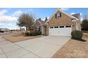 Brick home with a two-car garage and a spacious concrete driveway at 4001 Perth Rd, Fort Mill, SC 29707