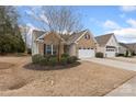 Beautiful brick home with an attached garage and manicured landscaping at 4001 Perth Rd, Fort Mill, SC 29707